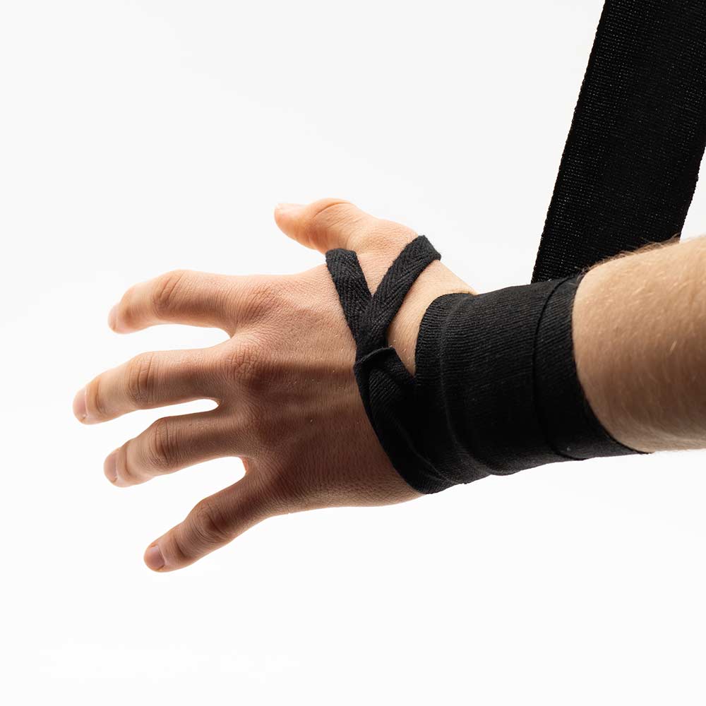 Black handwrap with a thumb loop and flat wraps around the wrist.