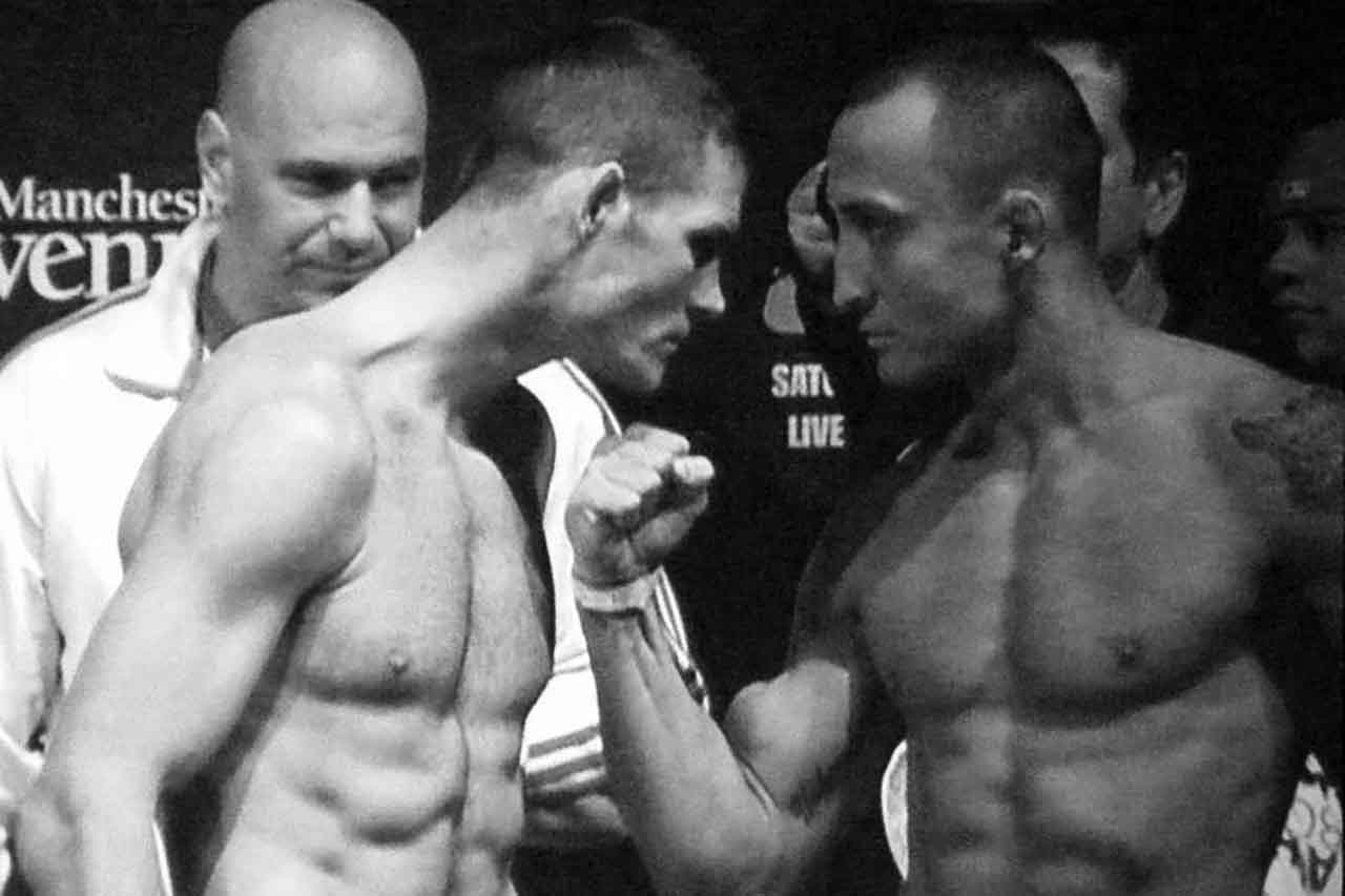 Denis Kang oikealla ja Michael Bisping punnituksessa UFC 105:tä varten